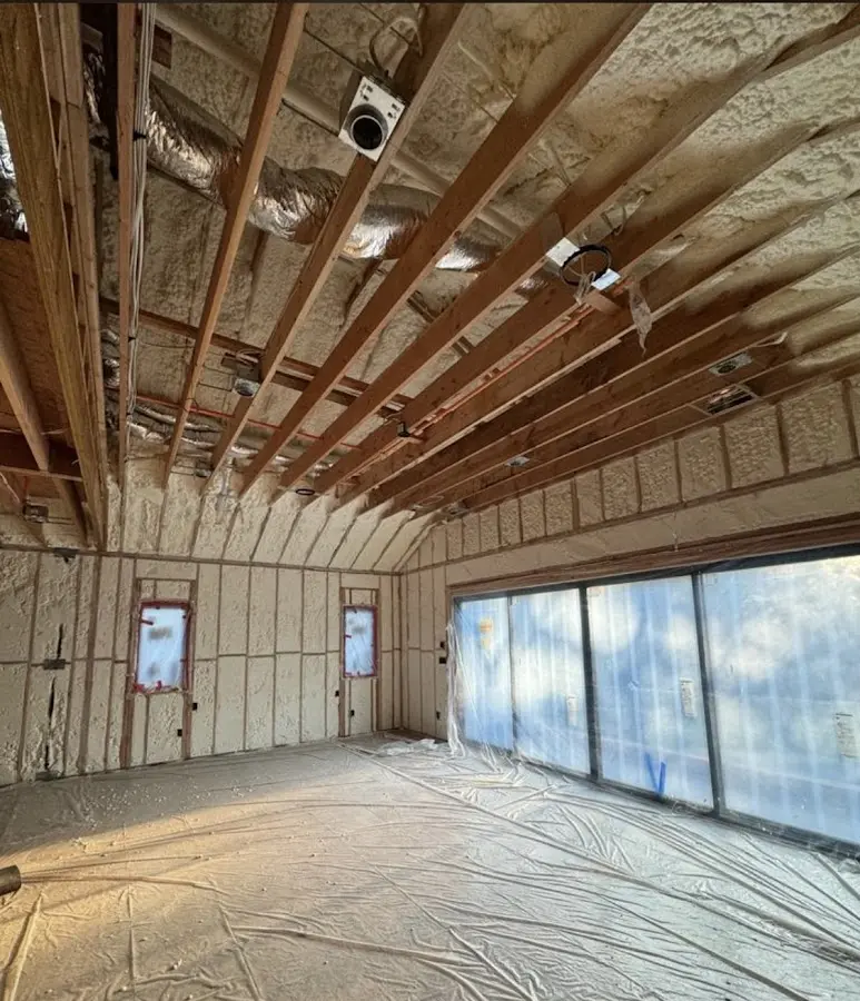 Interior walls and ceiling insulated with spray foam during new construction in Fulton